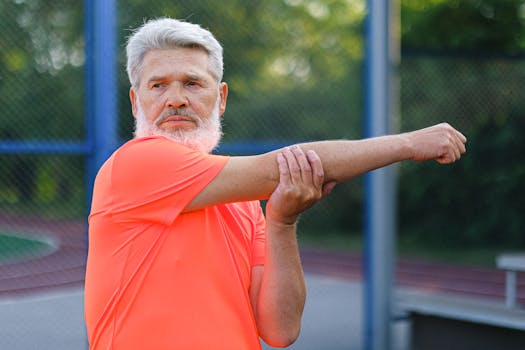 pexels photo 5067886 5067886 Stylish mature male athlete with modern hairstyle and beard in sportswear stretching before training on stadium